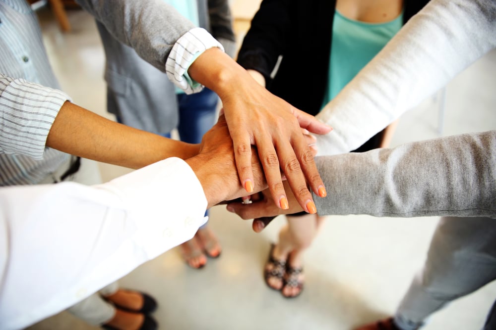 Business people joining hands Business people joining hands